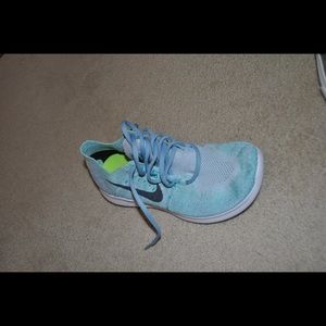 Nike turquoise sneakers. Size 7. Stretchy material. Barely worn